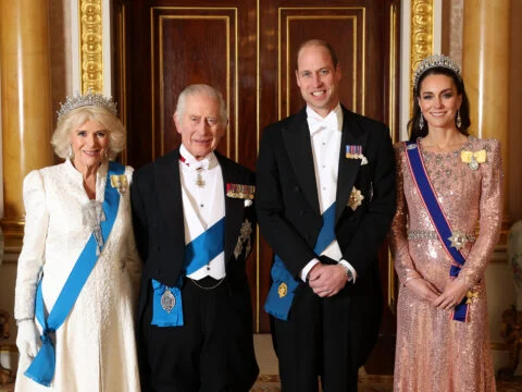 Queen Camilla, King Charles III, Prince William, Prince of Wales and Catherine, Princess of Wales pose for a photograph ahead of The Diplomatic Reception in the 1844 Room at Buckingham Palace on December 05, 2023 in London, England.